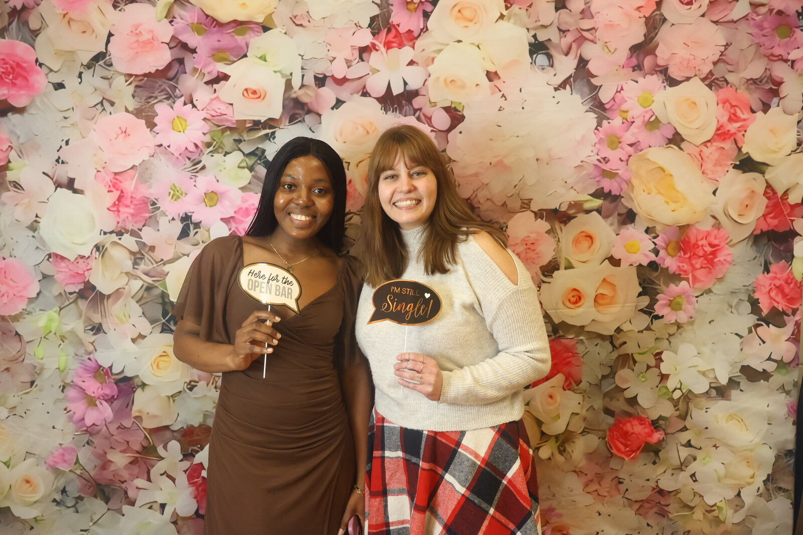Calgary wedding reception photo booth with floral backdrop